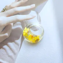 Product image of Epoxy-R Acrylic Ring with Dried Leaf and Flower Inclusions